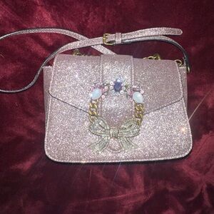 Aldo Glitter Shining Crossbody Bag with pink and silver embellished snap closure